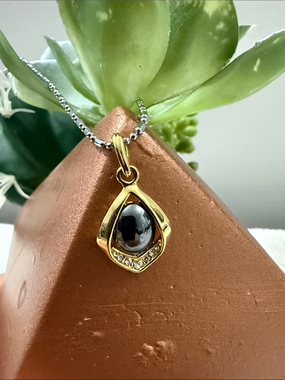Gold Teardrop Pendant Necklace with Black Stone and Accent Crystals